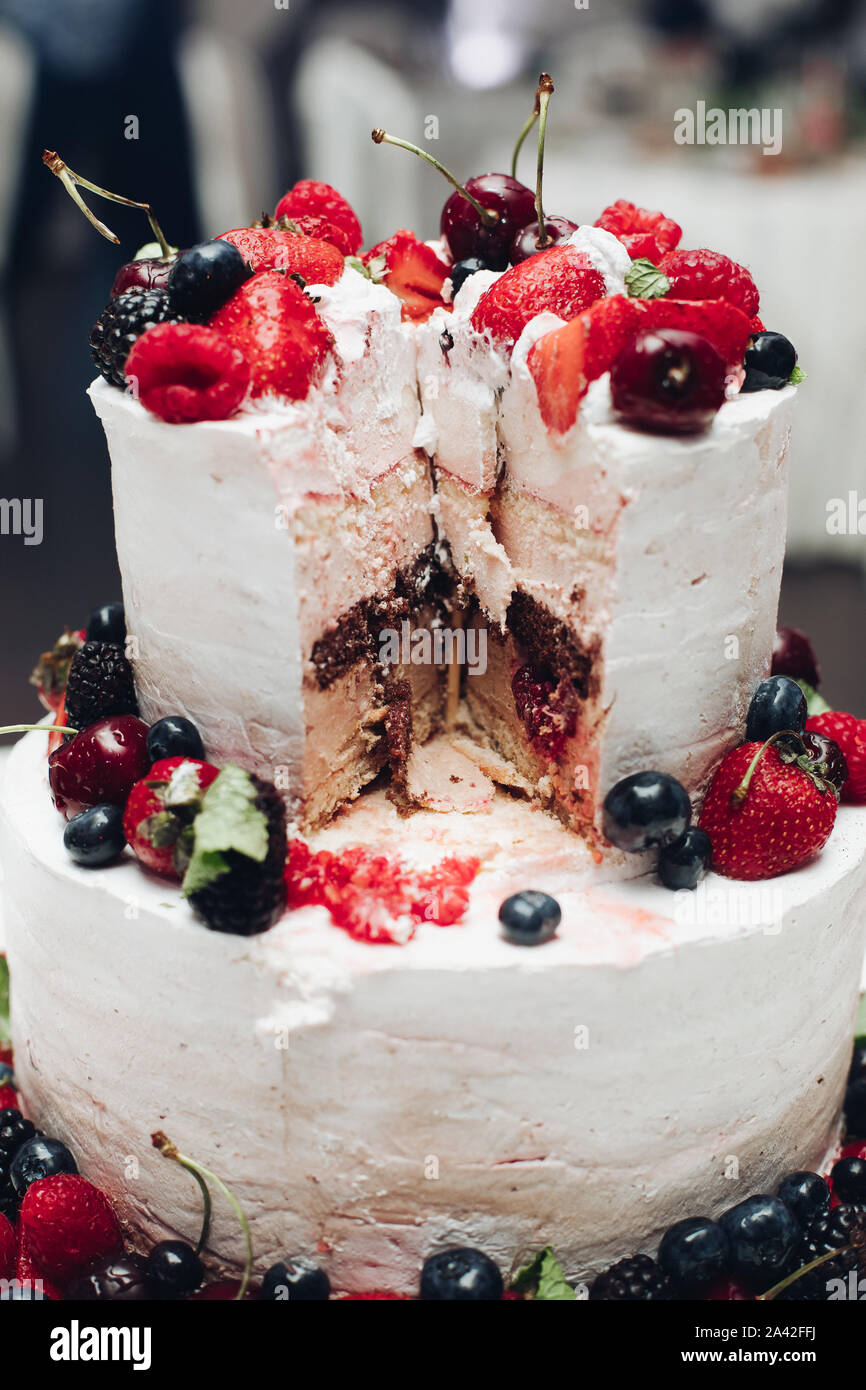 Close Up Of Delicious Sweet Wedding Cake Decorated With Fresh