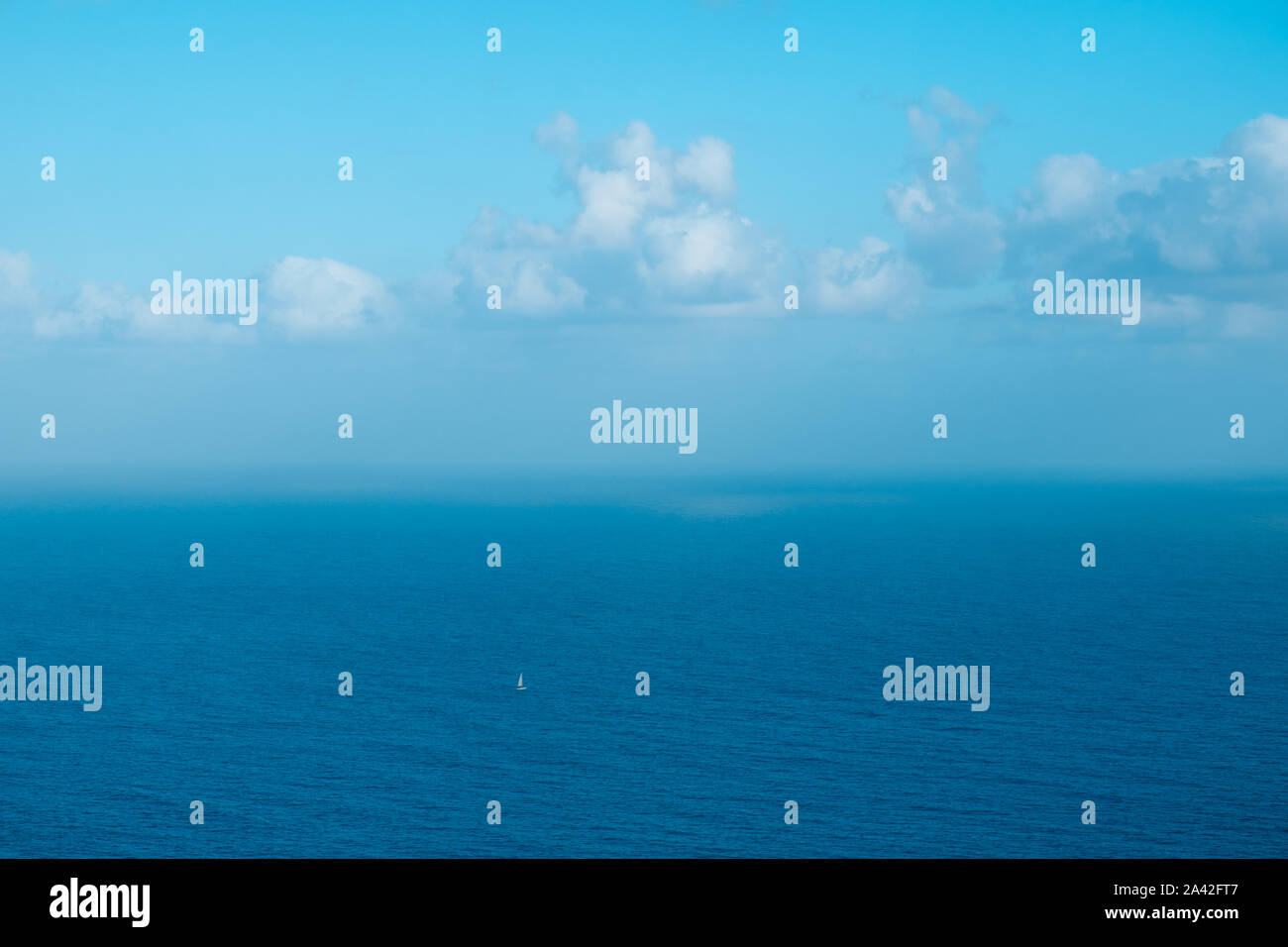 sailing boat far away on ocaen horizon, seascape aerial  - Stock Photo