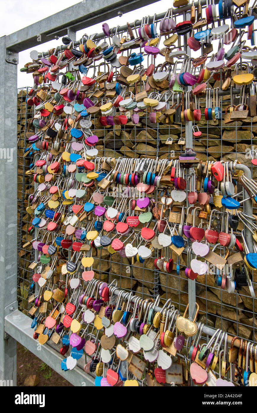 Lovelocks on a 6ft x 20 ft sculpture called 'The Wall of Love', (Artfe), located at the  rear of the Gretna Green Blacksmith's  shop wedding venue. Stock Photo