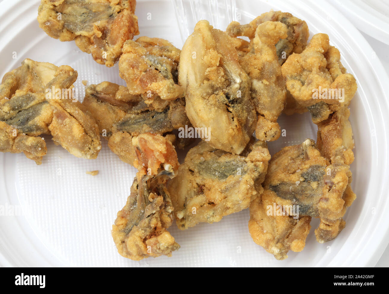 deep fried frogs on the dish is a typical food of padan plain in Italy Stock Photo