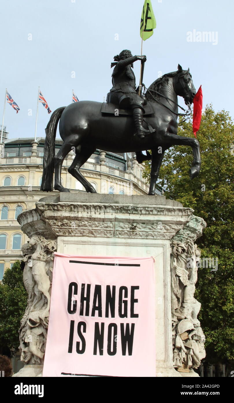 London, UK. 10th Oct, 2019. A placard saying 'Change is Now' during the protest.Extinction Rebellion demonstrators protest at the Trafalgar Square and Whitehall to highlight the 'climate emergency' facing the planet. Credit: SOPA Images Limited/Alamy Live News Stock Photo