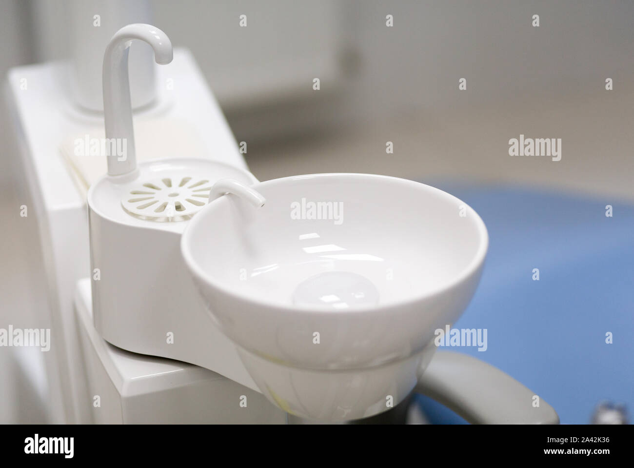 White washbasin in dentist clinic. Stomatological equipment. Stock Photo