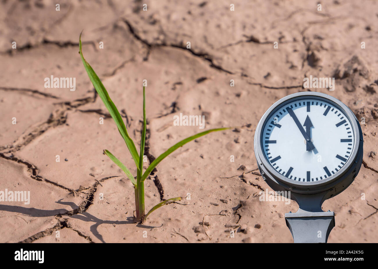 Climate change dryness with clock symbolic Stock Photo Alamy