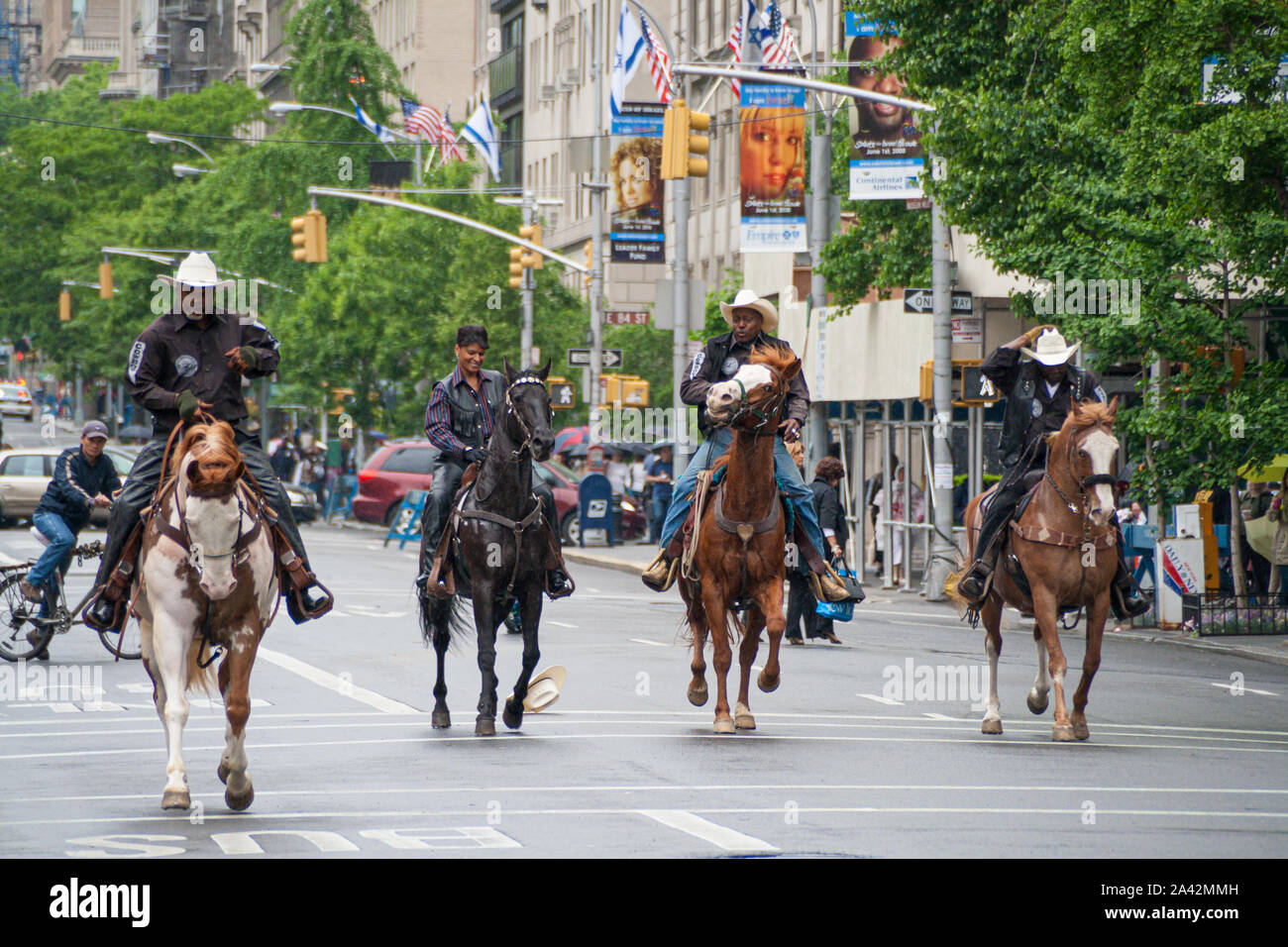 New York, USA. May 2008: Cowboys ride horses in 5th avenue near Central Park Stock Photo