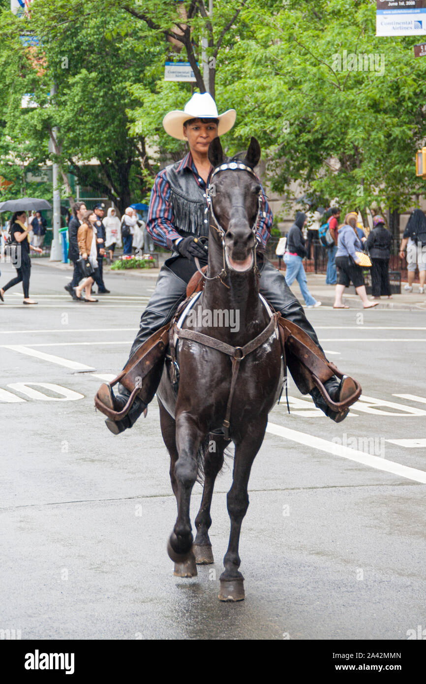 New York, USA. May 2008: Cowboys ride horses in 5th avenue near Central Park Stock Photo