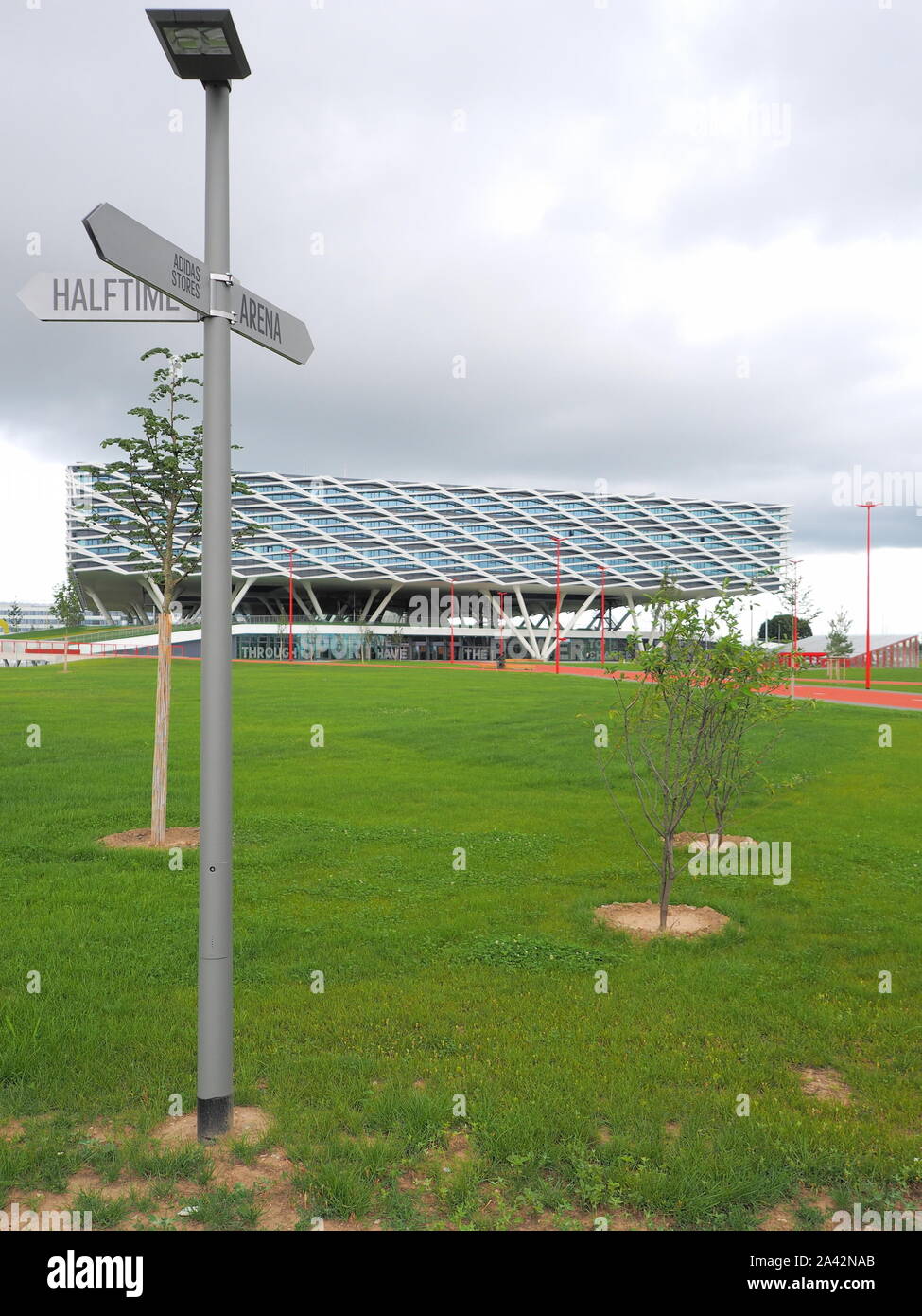 Herzogenaurach Germany August 19 2019 Direction sign and building called Arena the new 2019 opened Headquarter of global sports brand Adidas in Stock Photo Alamy