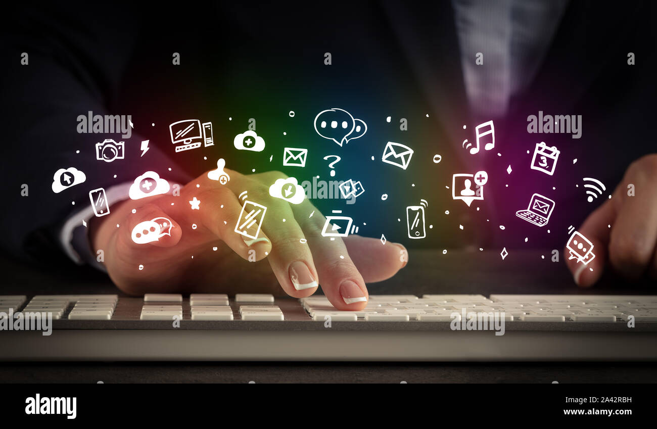 Blogger woman typing on keyboard with drawn application icons around ...