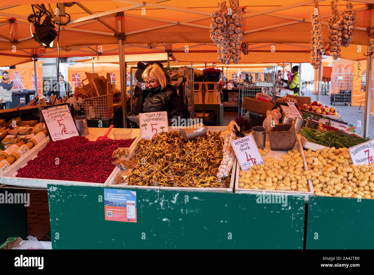 Lingonberries and chanterelle mushrooms on a market stall, Market Square, Helsinki, Finland Stock Photo