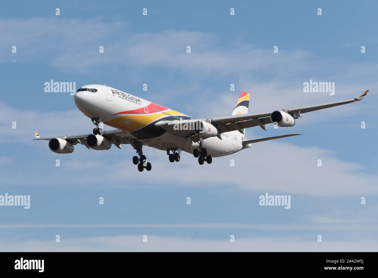 Airbus A340-313 Air Belgium Coming into London Heathrow Airport in the United Kingdom 00-ABA Stock Photo