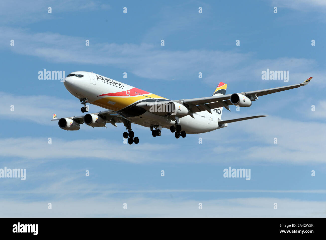 Airbus A340-313 Air Belgium Coming into London Heathrow Airport in the United Kingdom 00-ABA Stock Photo
