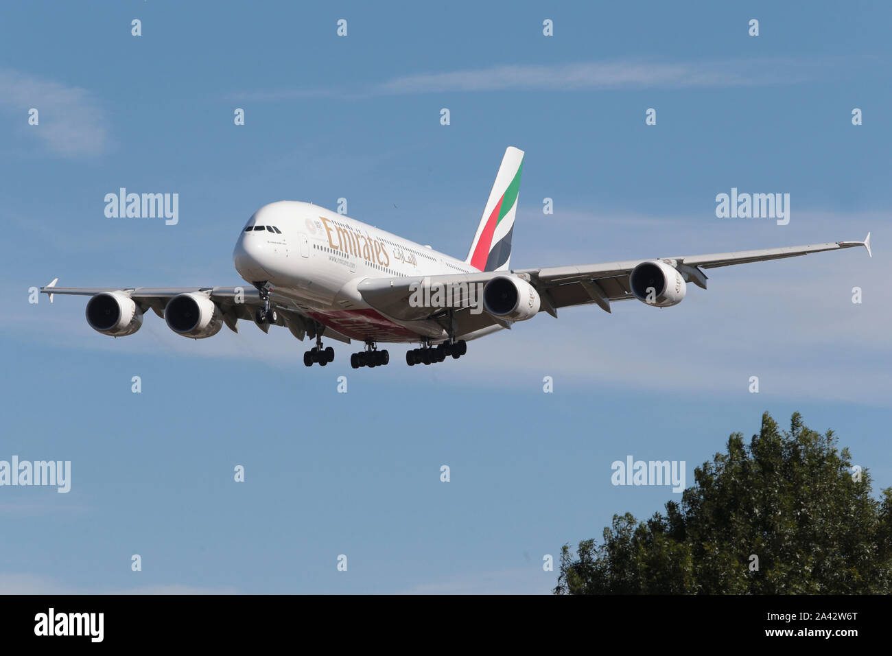 Emirates Airbus A380-800 double decker plane coming down to land at London Heathrow Airport in the United Kingdom Stock Photo