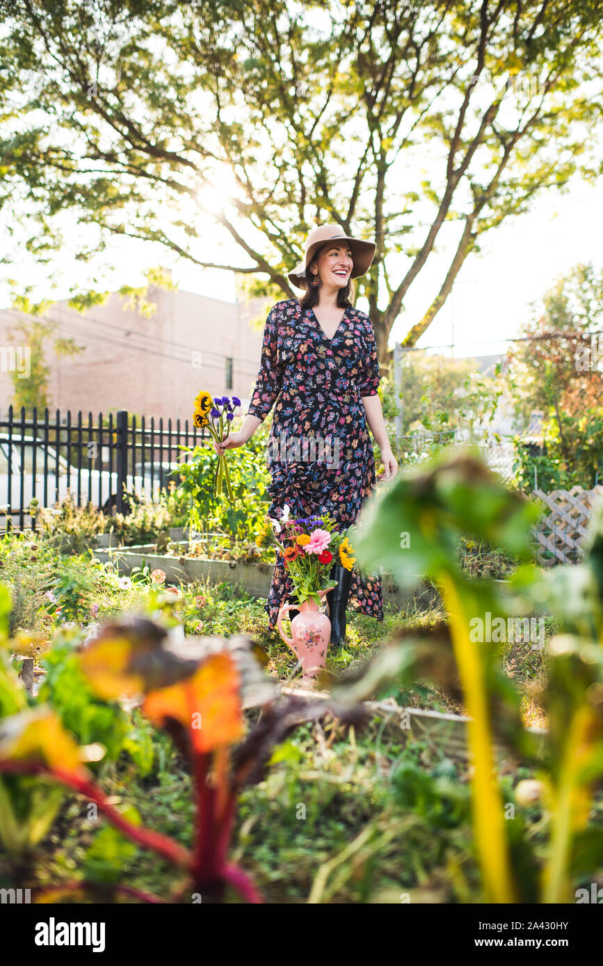 Woman holding flowers garden hi-res stock photography and images - Alamy