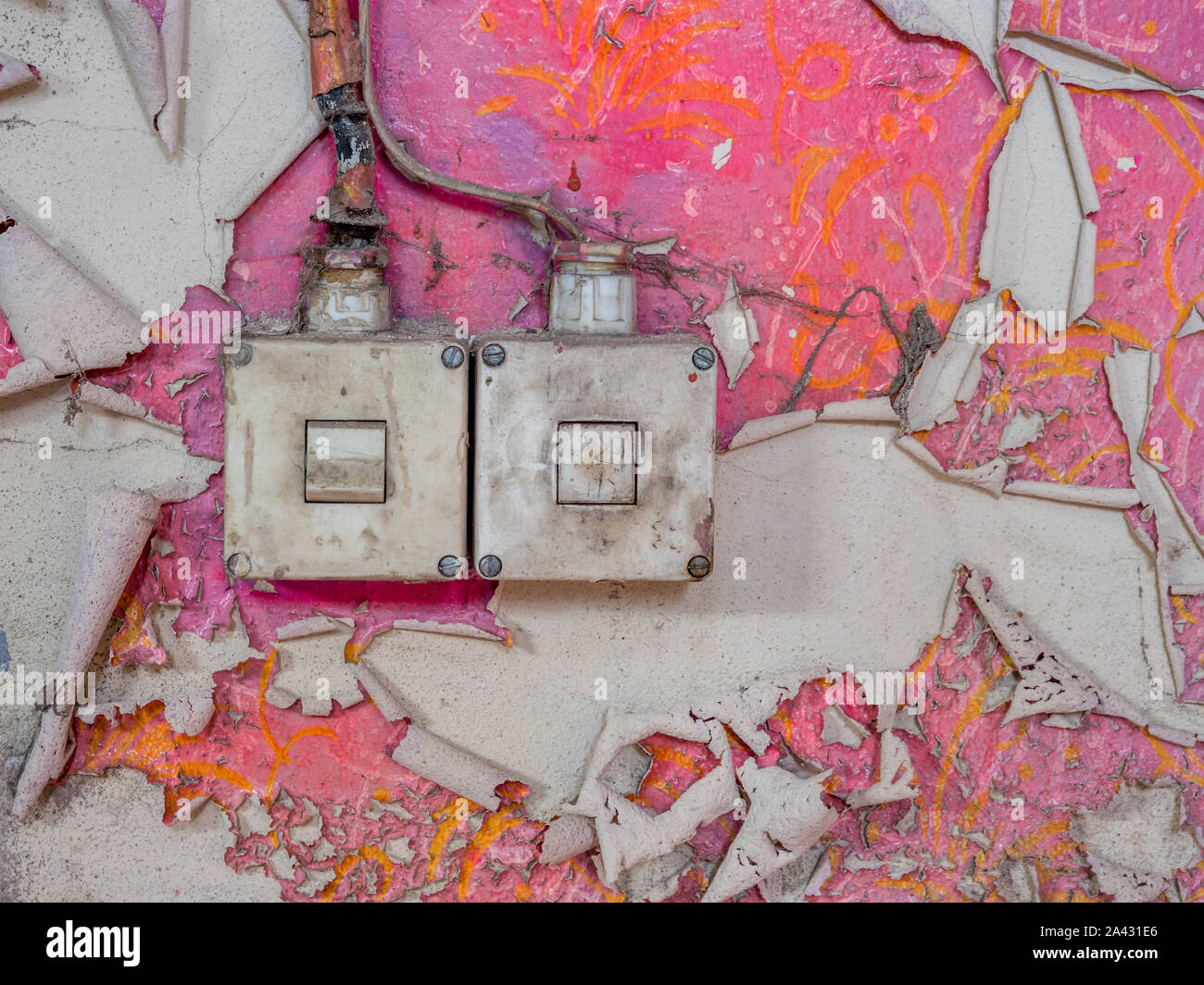 Retro light switch on a pink wall Stock Photo