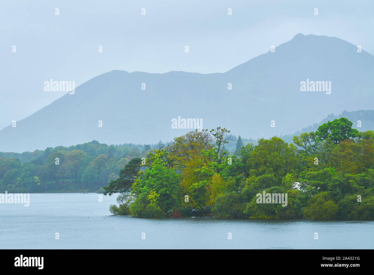 Outline of the ridge on Cat Bells mountain during a cloudy, rainy day at Lake Derwentwater, Lake District national park, Cumbria, England. Stock Photo