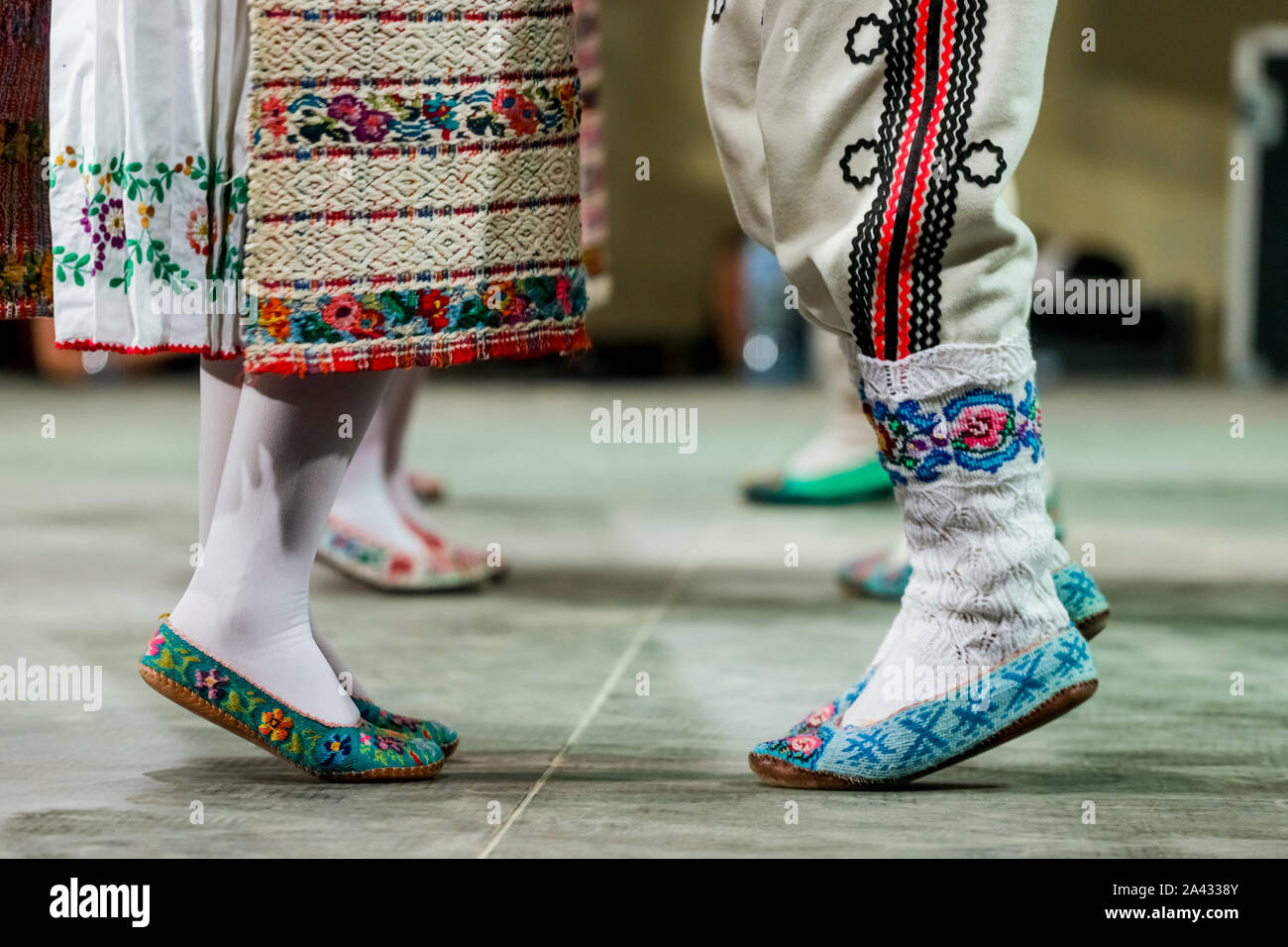 Close up of wool socks on legs of young Romanian female and male