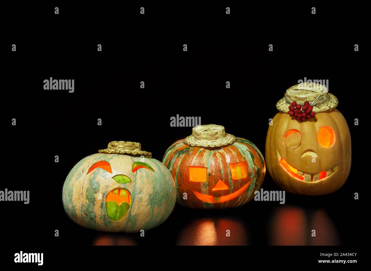 Halloween pumpkins funny and horrible on a black background Stock Photo