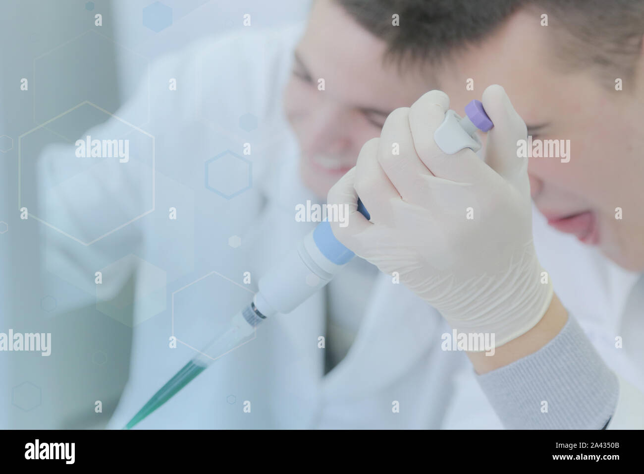 Two young male scientists doing experiments in laboratory Stock Photo