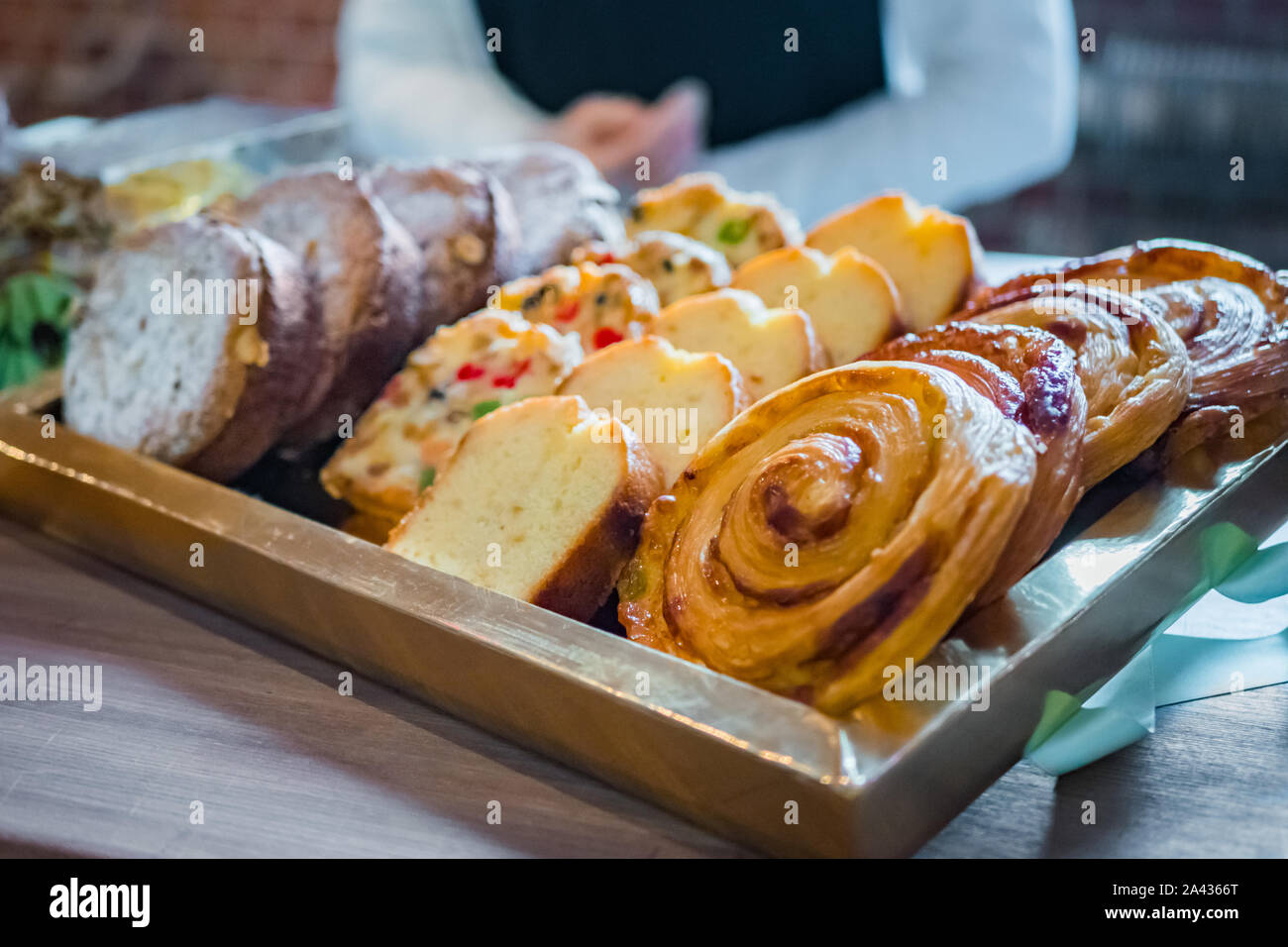 Assortment of freshly baked sweet pastry for sale on counter of french