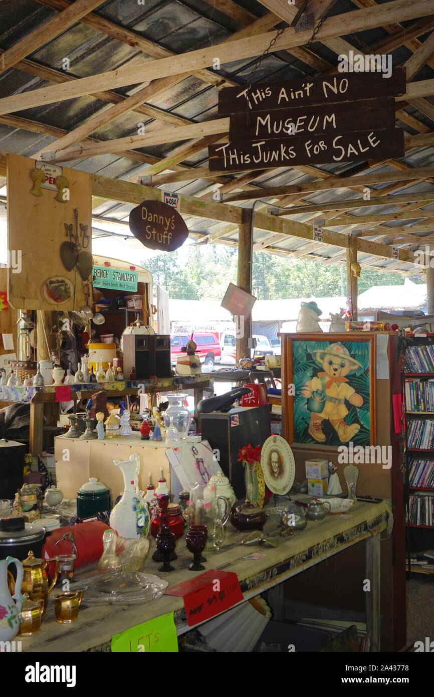 Stall at a flea market. Sign says 'This ain't no museum. This junk's for sale' Stock Photo