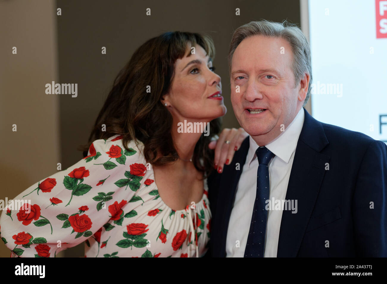 Cologne, Germany. 11th Oct, 2019. Actors Fiona Dolman (l) and Neil Dudgeon (r) can screen the first episode of the 21st season of the crime series 'Inspector Barneby' as part of the Film Festival Cologne 2019. Credit: Henning Kaiser/dpa/Alamy Live News Stock Photo