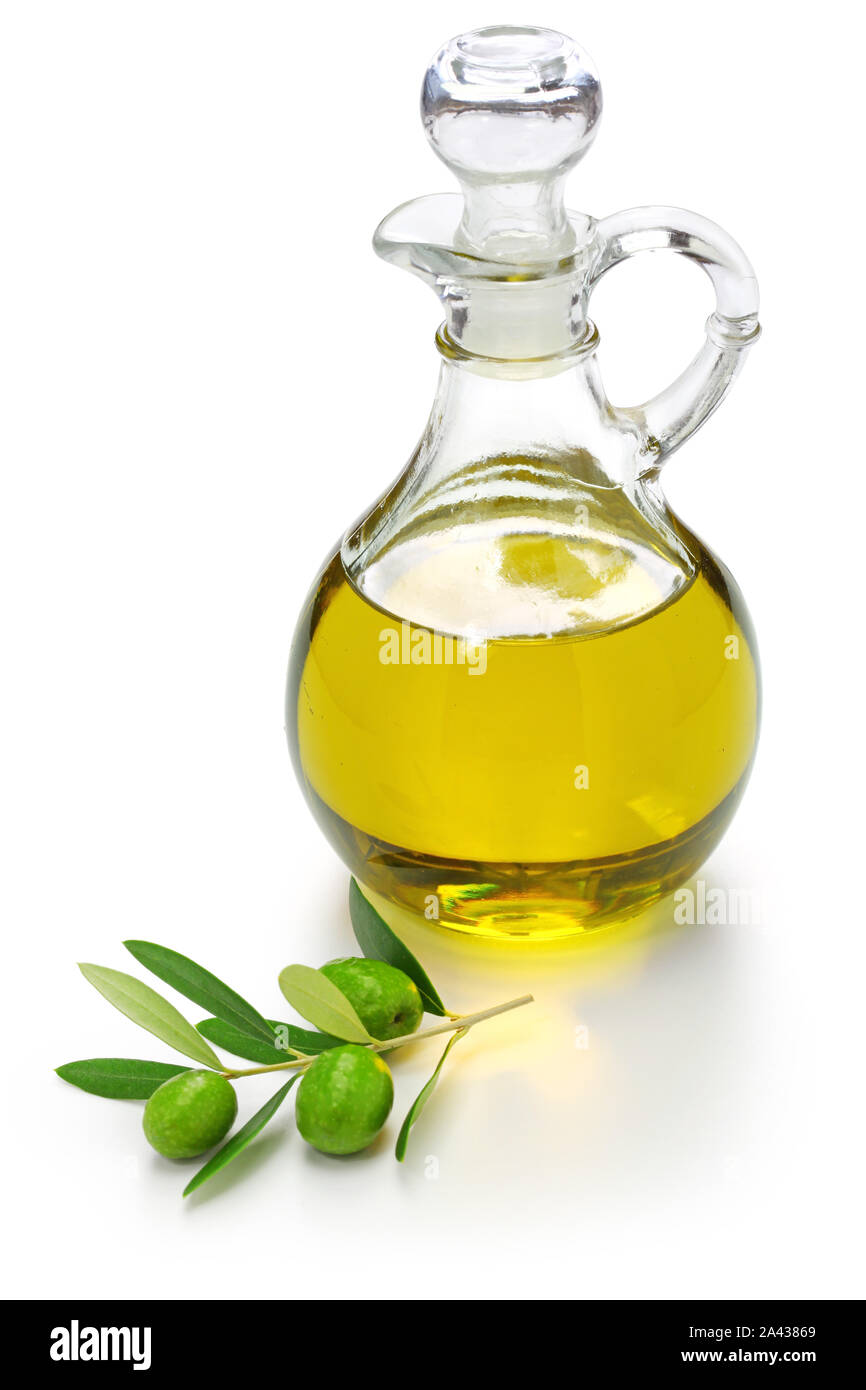 extra virgin olive oil with green olives and leaves isolated on white ...