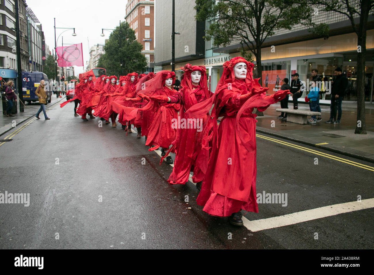 Red Rabbit Protest London, UK - 11 October 2019. The Red Rebel Brigade from Extinction ...