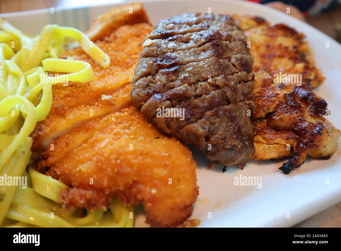 Delicious Cooked Fresh Food in Turkish Restaurant. Grilled Meat and Chicken. Stock Photo