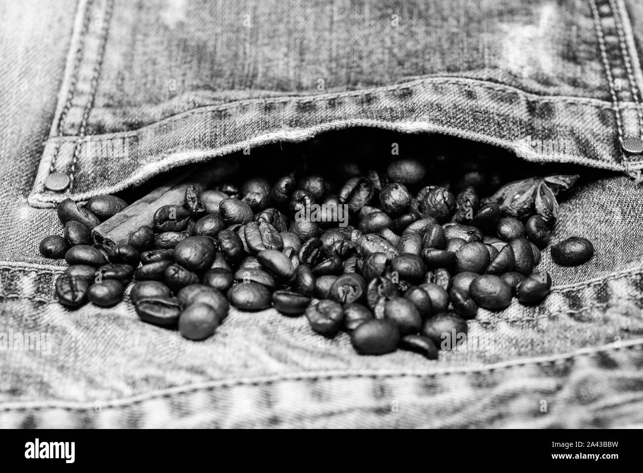 Coffee for inspiration and energy charge. Beans and spices in jeans