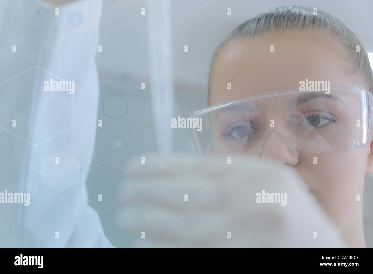 Young female scientist doing experiments in laboratory Stock Photo