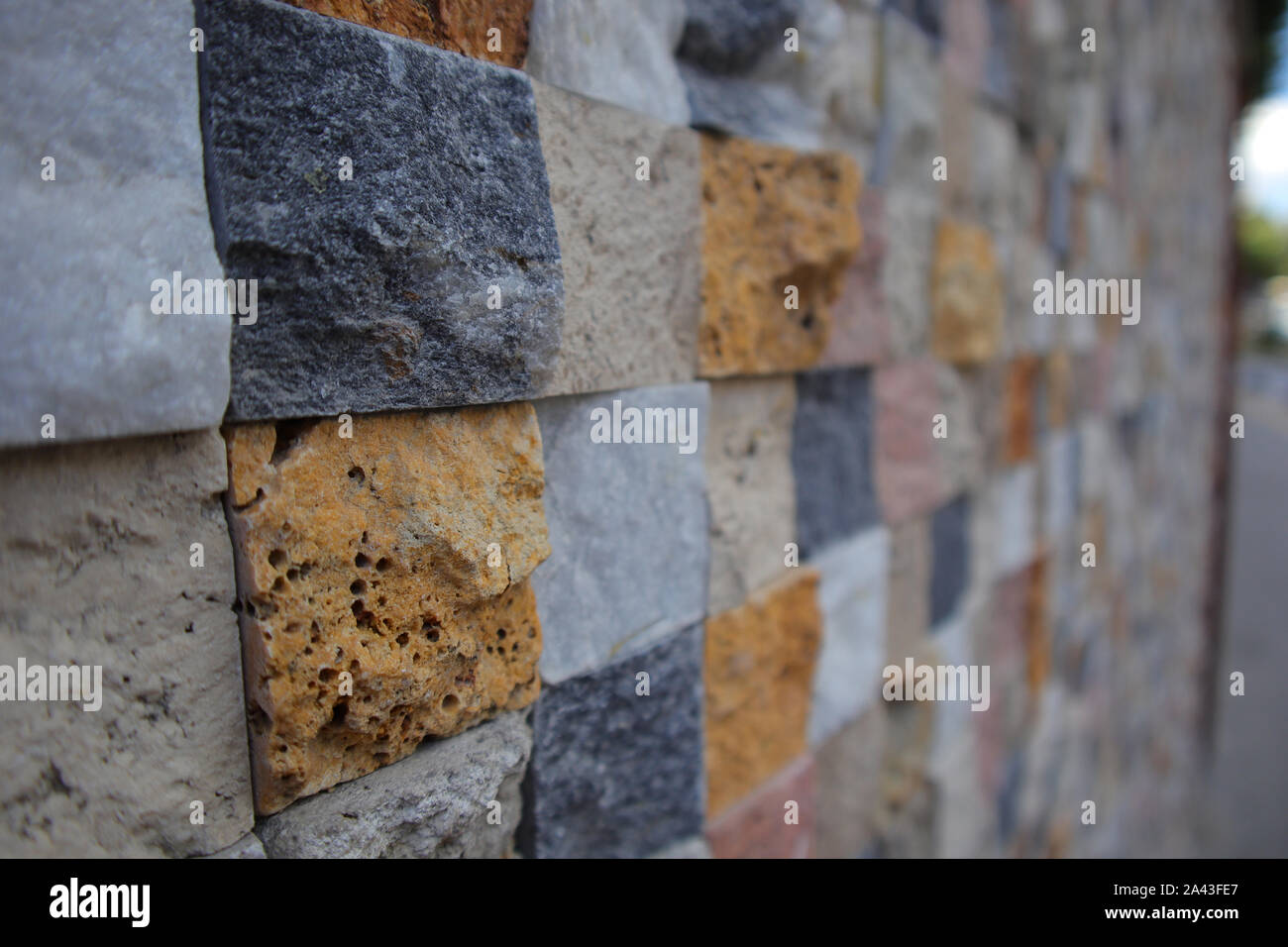 New Colored Wall Made From New Cutted Stone. Texture Pattern Structued Rough. Stock Photo