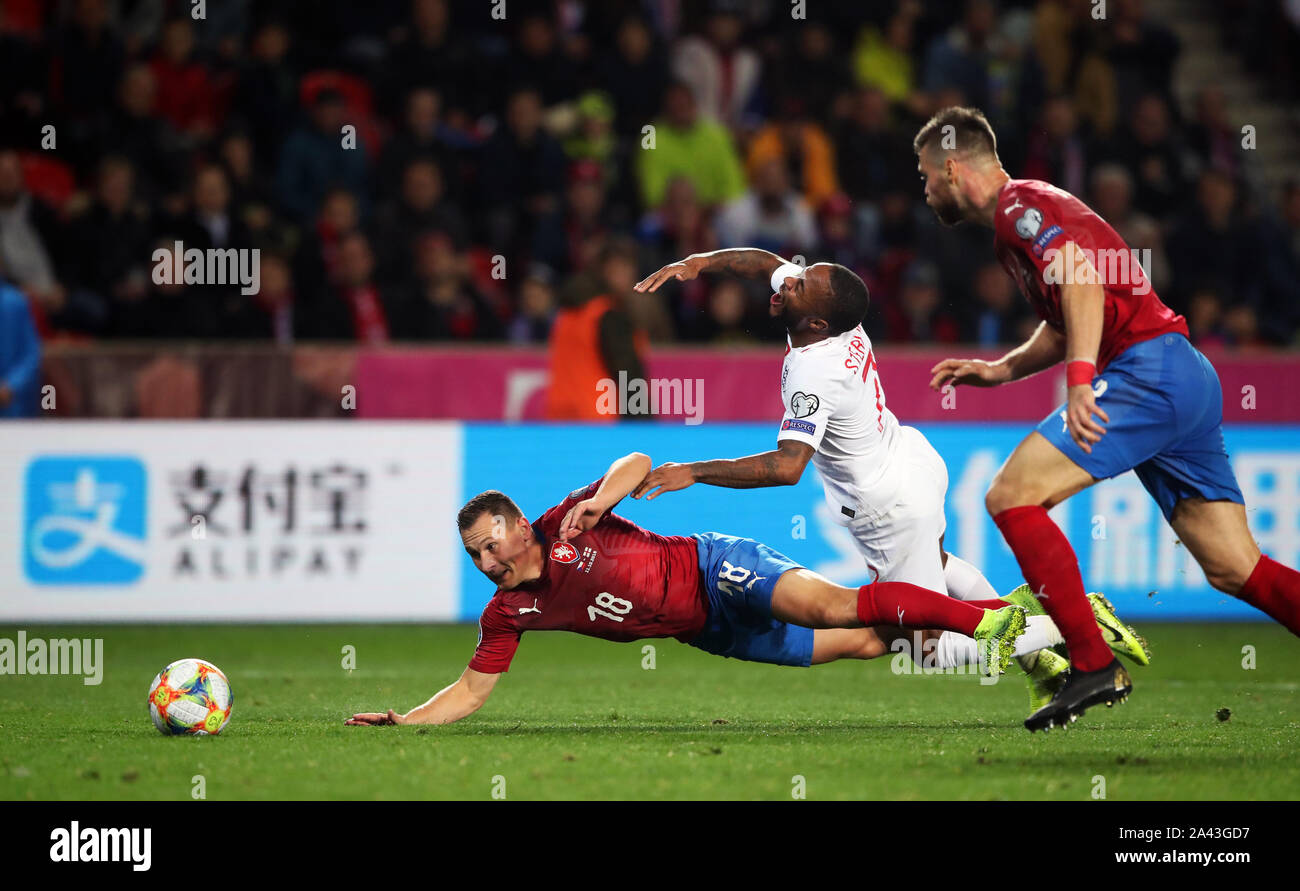 Czech Republic's Jan Boril (left) and England's Raheem Sterling battle for the ball during the UEFA Euro 2020 qualifying, Group A match at Sinobo Stadium, Prague. Stock Photo