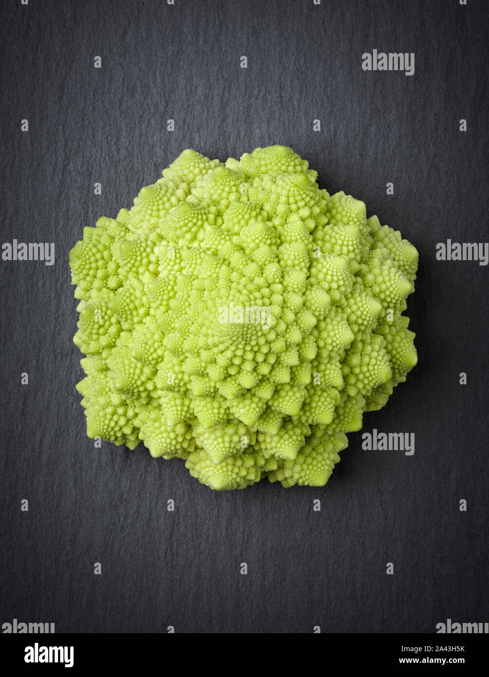 Romanesco broccoli isolated on a stone slab. Stock Photo