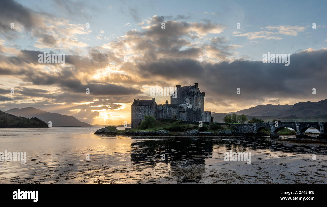 Dramatic sunset sky behind Eilean Donan Castle, Scotland Stock Photo