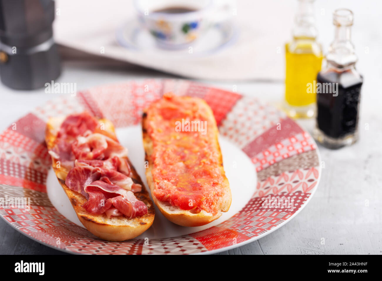 Spanish tomato and ham toast, traditional breakfast or lunch Stock