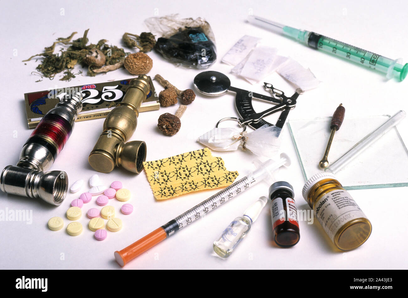 Illicit drugs and paraphernalia on display Stock Photo