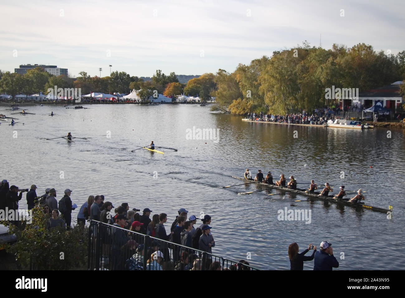 Boston, MA / USA - October 22, 2019: Spectators line up along the shores to watch the teams row up to the starting line in the morning Stock Photo