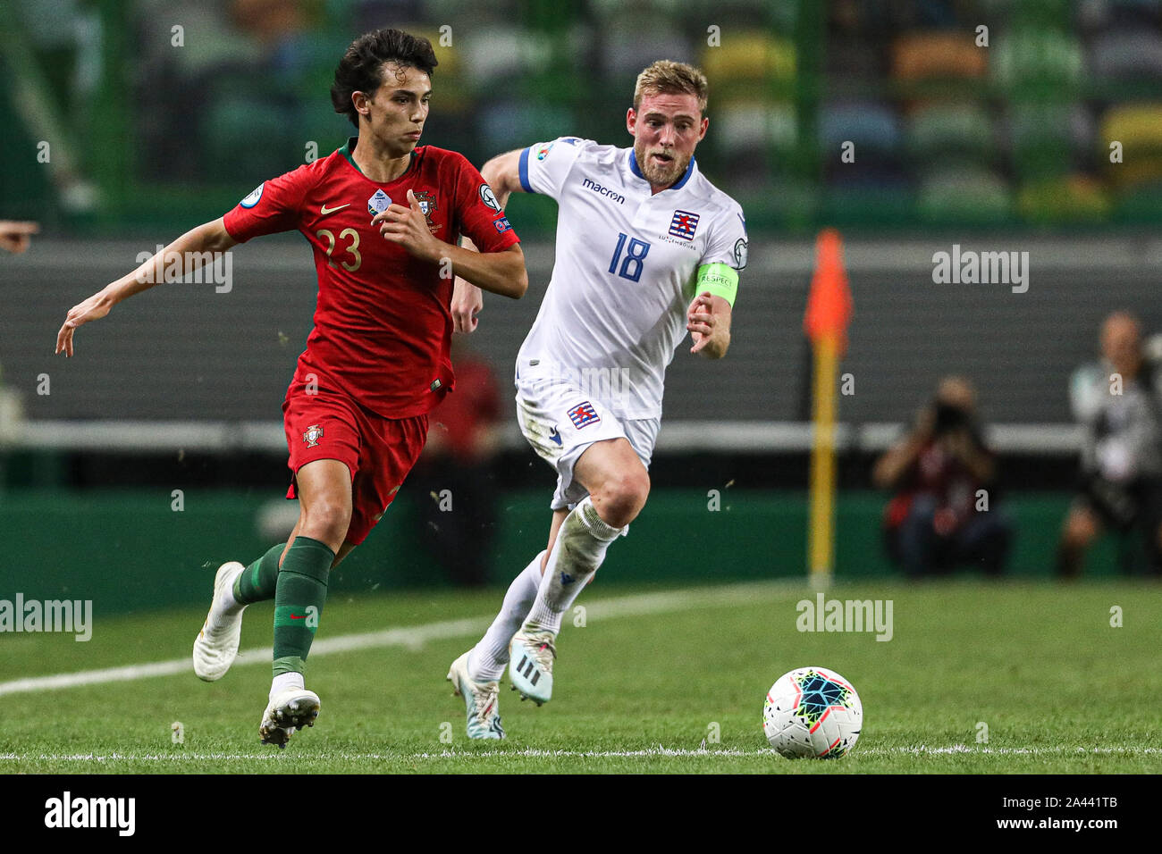 João Félix of Portugal (L) and Laurent Jans of Luxembourg (R) are seen
