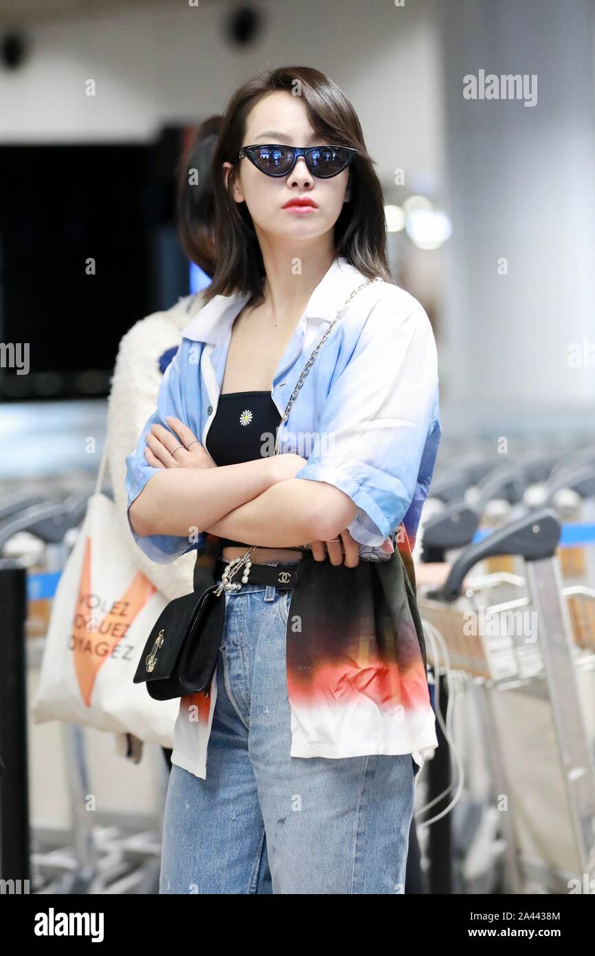 Chinese singer and actress Victoria Song or Song Qian arrives at the Beijing Capital International Airport after landing in Beijing, China, 17 August Stock Photo