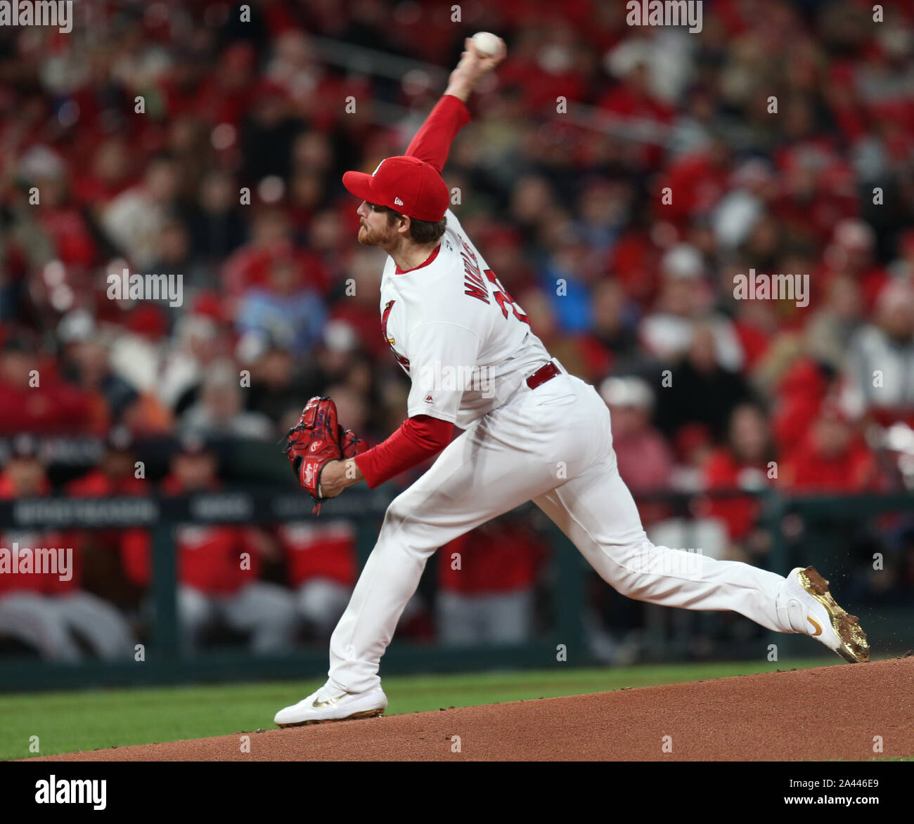 The socks and cleats worn by St. Louis Cardinals' Miles Mikolas are seen as  he throws during a baseball game against the Cincinnati Reds in Cincinnati,  Thursday, May 25, 2023. (AP Photo/Aaron