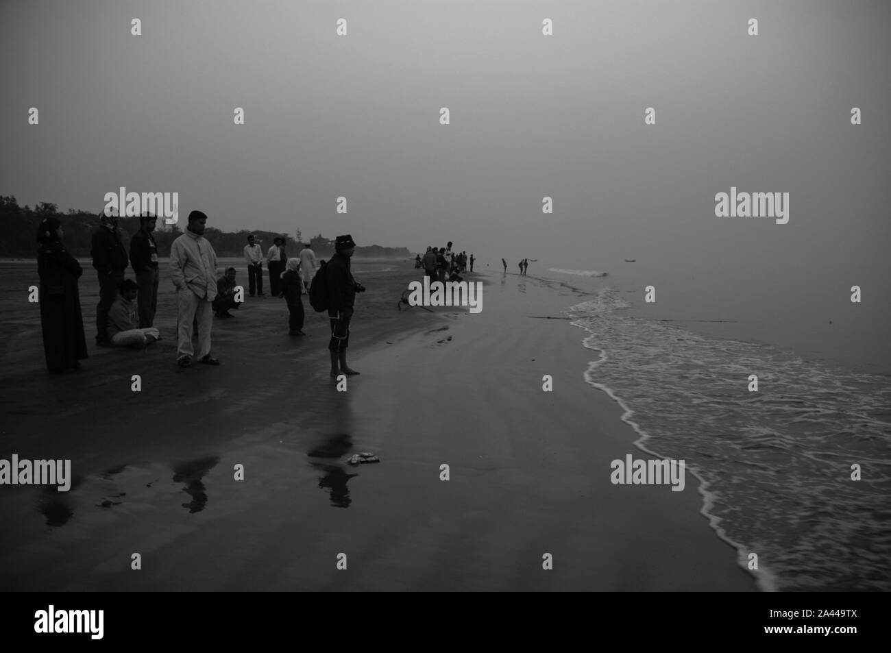 Tourists at Kuakata sea beach in a foggy winter morning. Patuakhali, Bangladesh Stock Photo