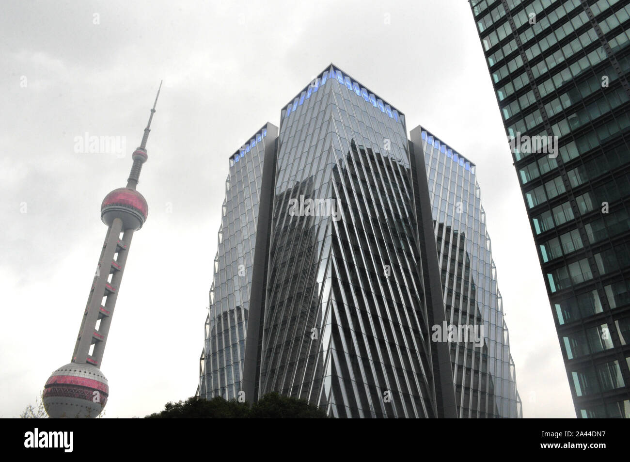 --FILE--The Foxconn headquarters building is under construction along the Oriental Pearl TV Tower in Pudong, Shanghai, China, 2 December 2018.   Tech Stock Photo