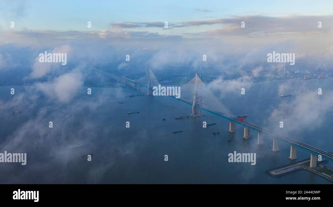 Aerial view of clouds above Shanghai-Nantong Yangtze River Bridge in Nantong city, east China’s Jiangsu province before Lekima, the 9th typhoon of the Stock Photo