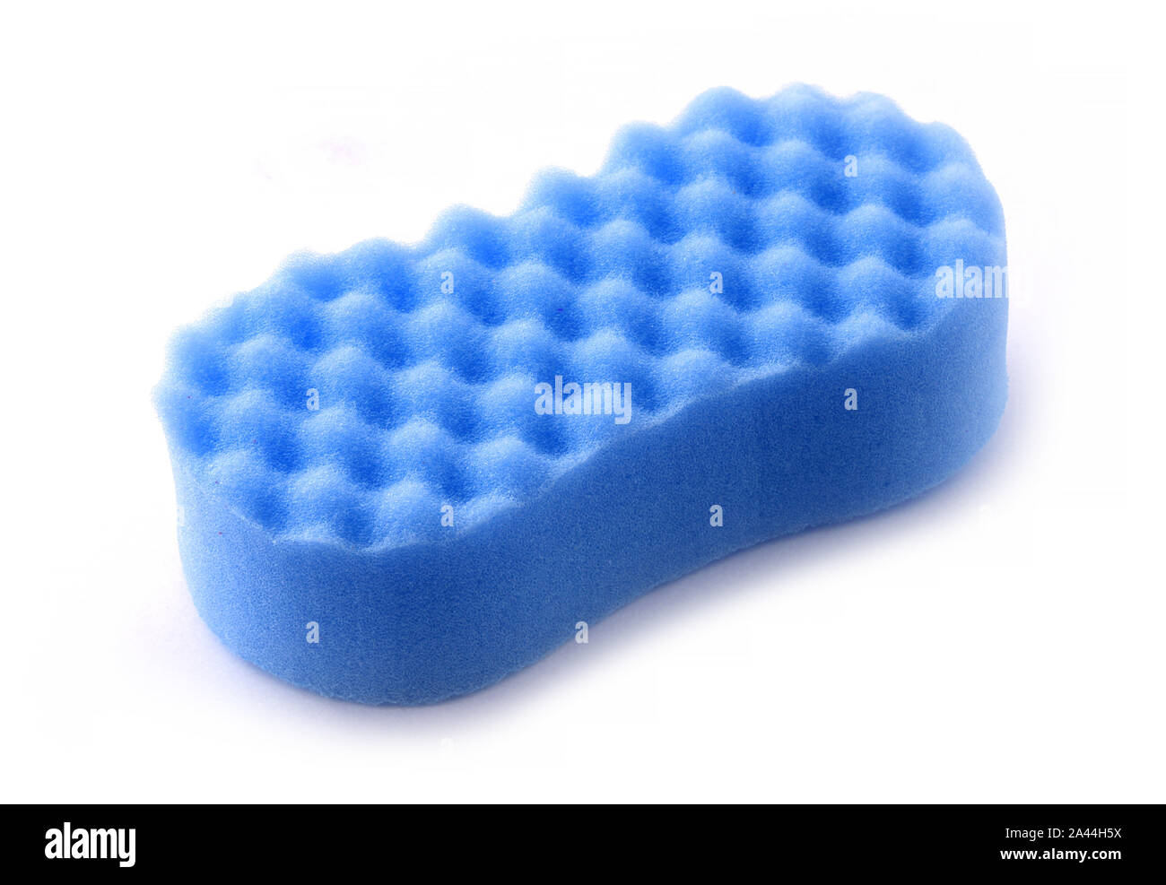 Blue sponge for washing dishes on a white background. The sponge has a