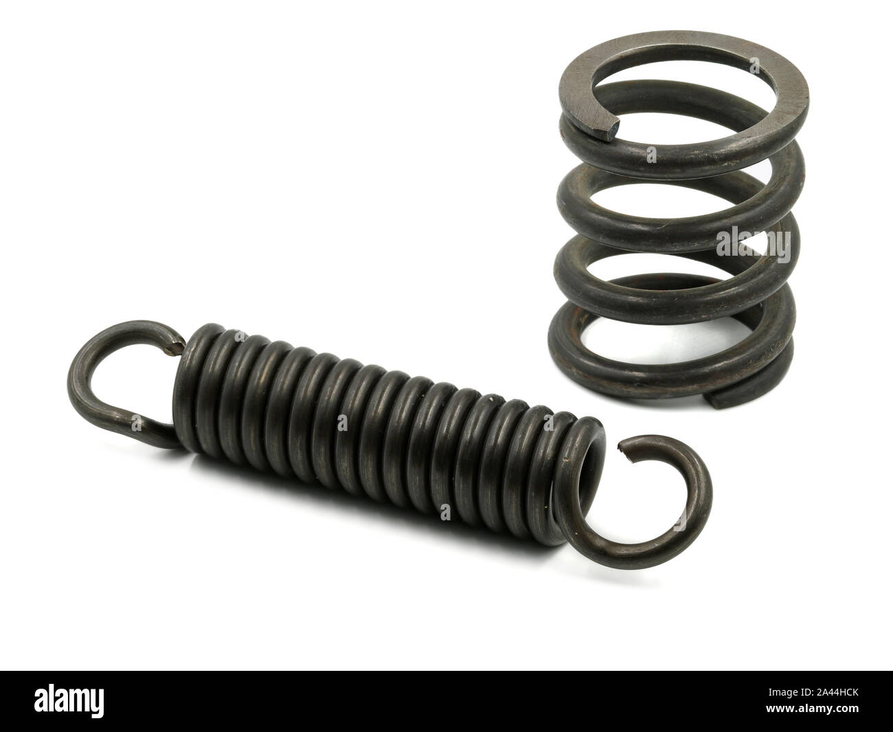 blank metal compression and tension spring are isolated on white background Stock Photo
