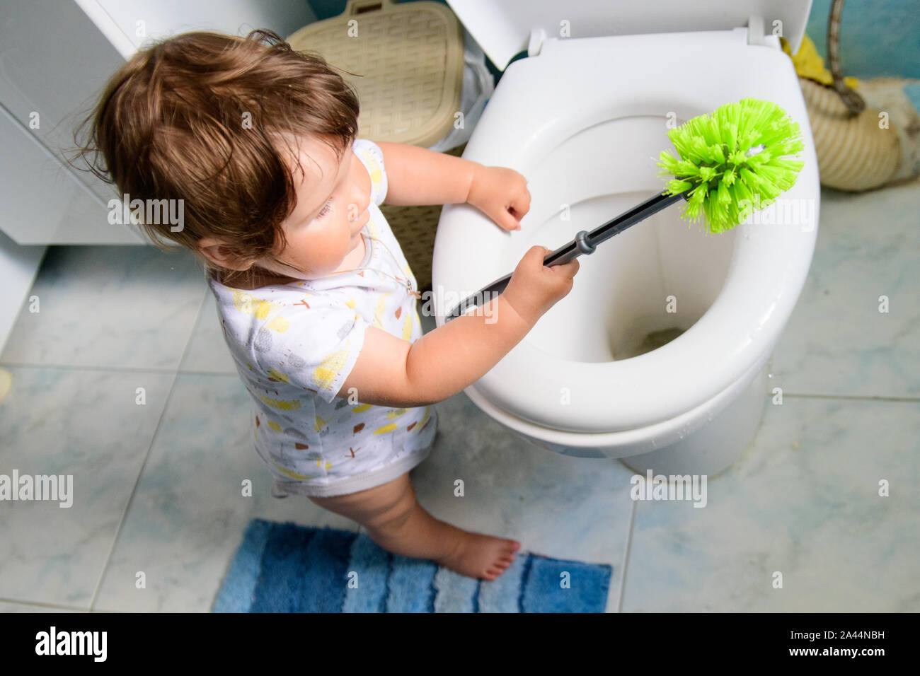 baby and cleaning. help mom with cleaning. toilet and baby. training