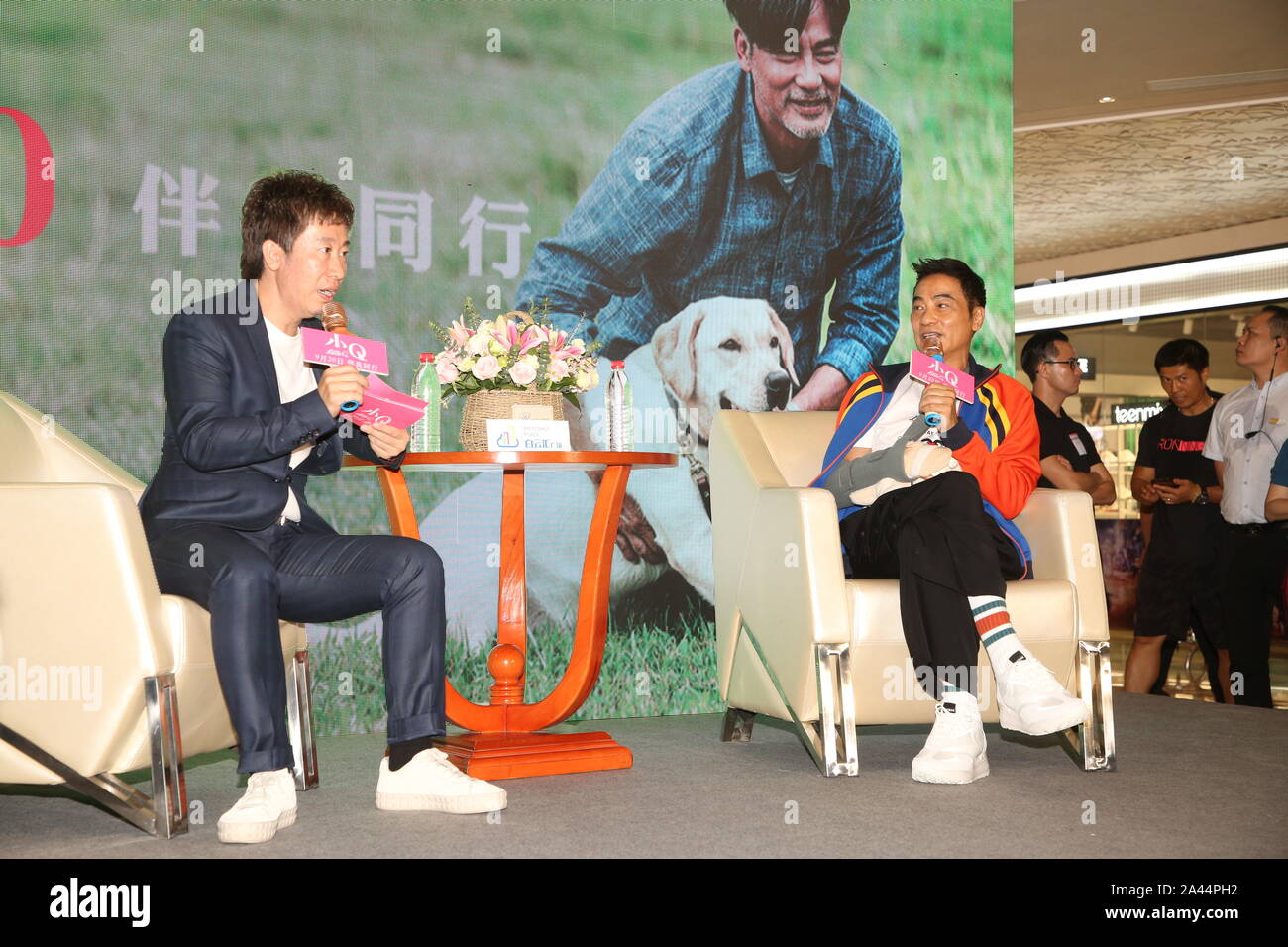 Simon Yam Tat Wah, right, after being stabbed, appears at a promotional event of film Little Q in Zhongshan city, south China¯s Guangdong province, 12 Stock Photo