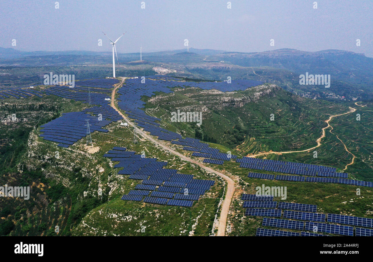 Aerial view of the hybrid power plant of both solar and wind power, which is capable of generating 870 million kWh annually, established in Shanting d Stock Photo