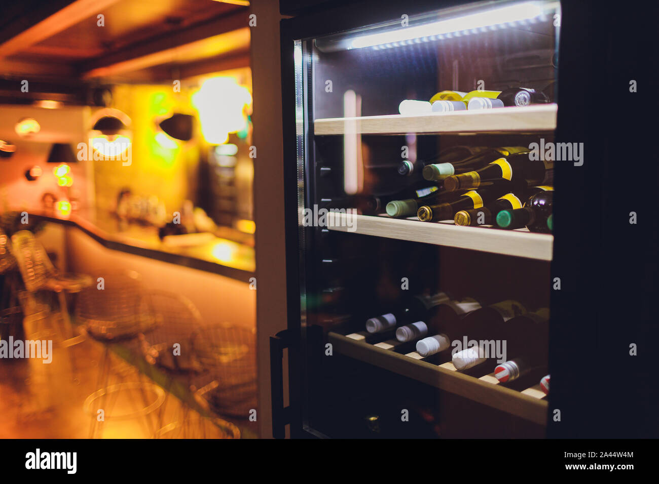 Storing bottles of wine in fridge. Alcoholic card in restaurant