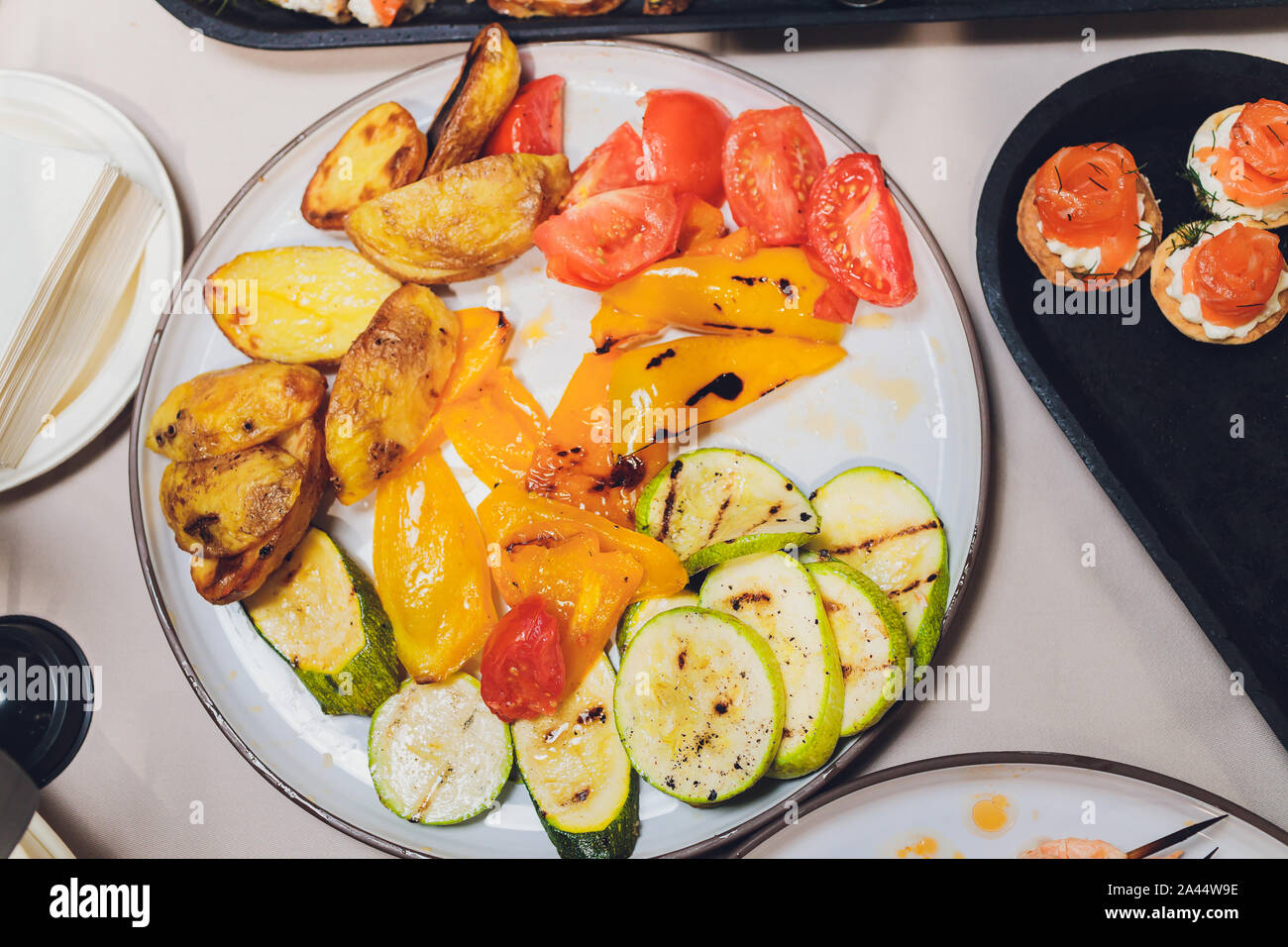 Different types of canapes on buffet table Stock Photo