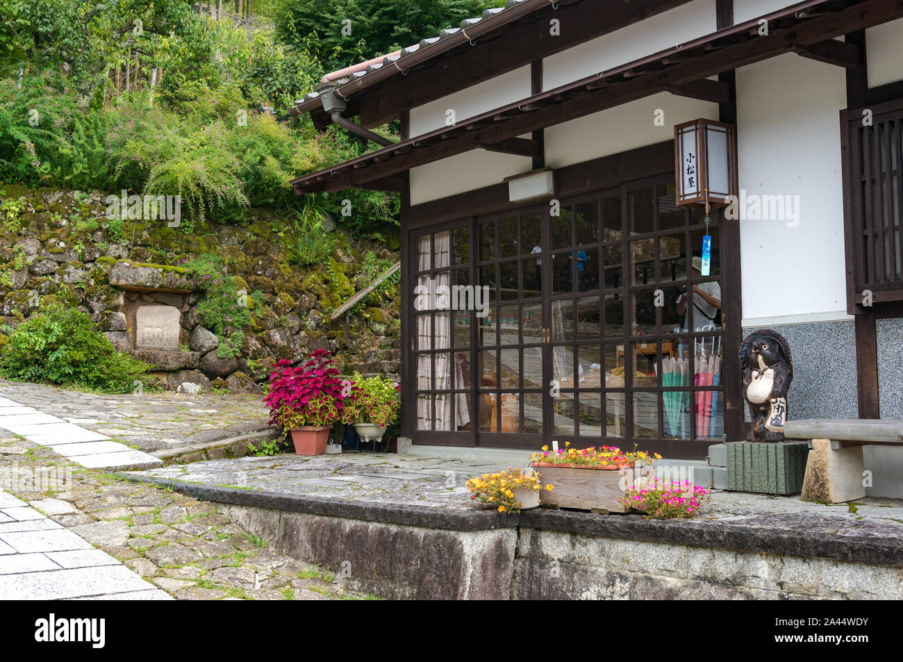 Magome, Japan - September 5, 2016: Shirakiya hotel in traditional Japanese architecture style with sliding doors and rice paper walls. Magome postal t Stock Photo